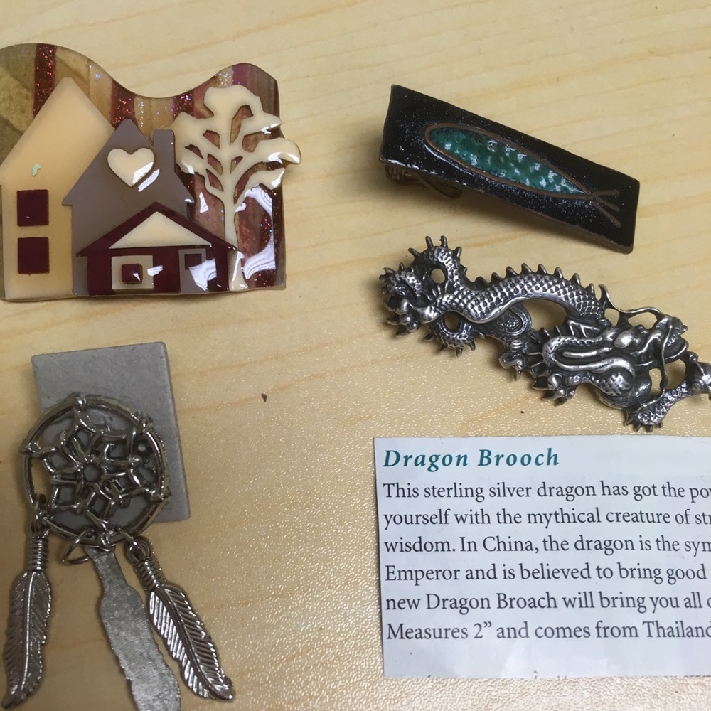 Set of four brooches